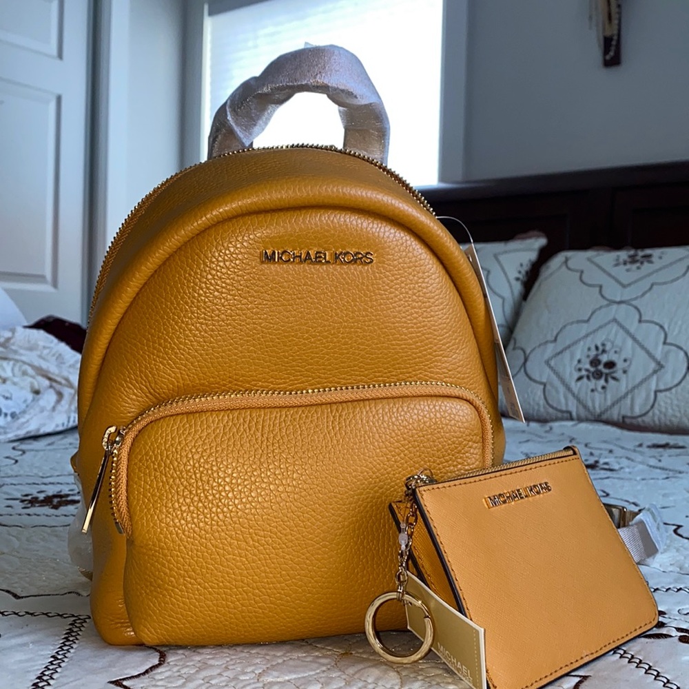 mustard yellow convertible Michael Kors backpack